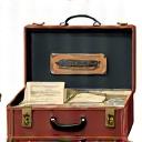 Visual of a meticulously packed vintage travel trunk or comprehensive travel documents, signifying final preparations.